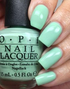 sea green nails with nail polish containerby opi