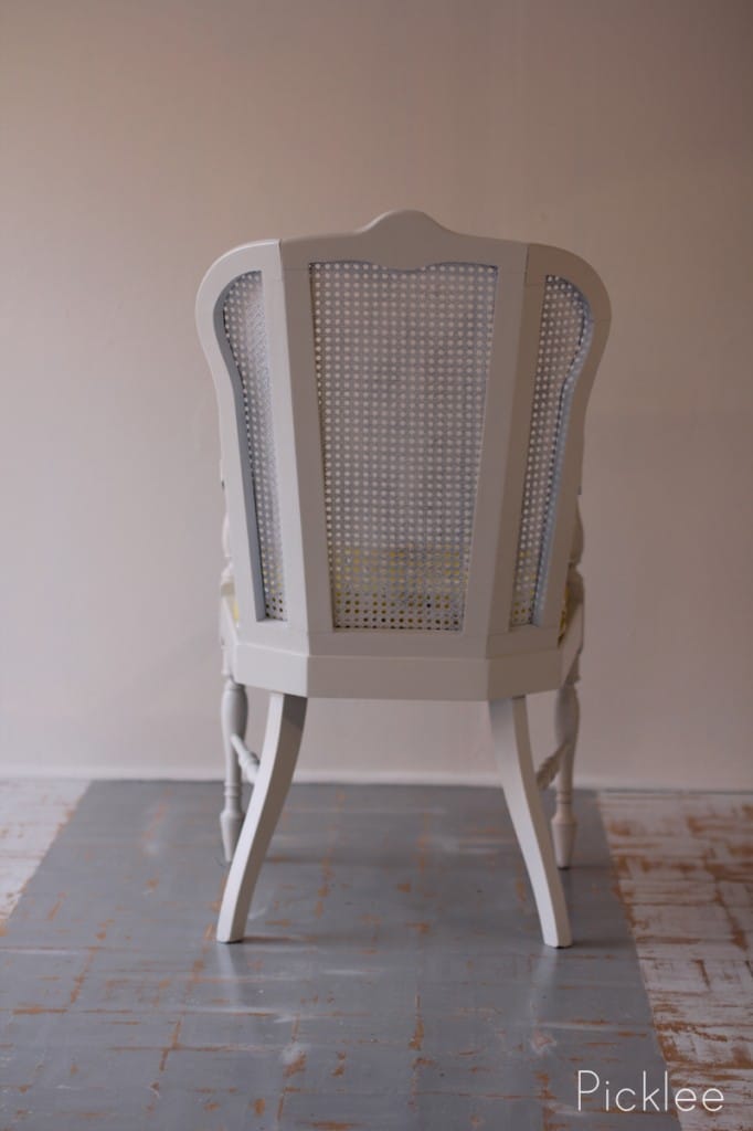 white cane arm chair yellow cushion3