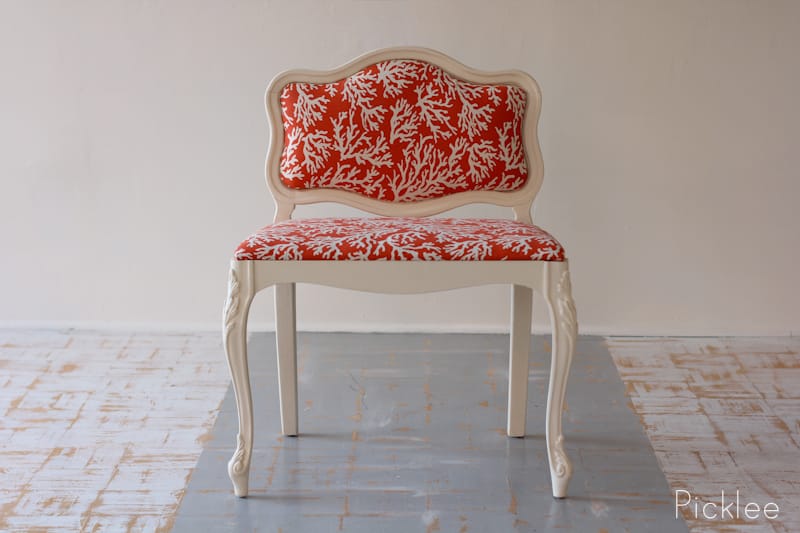 vintage slipper chair with coral pring and white trim