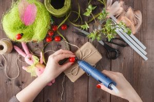 female making a diy craft with wrapping paper